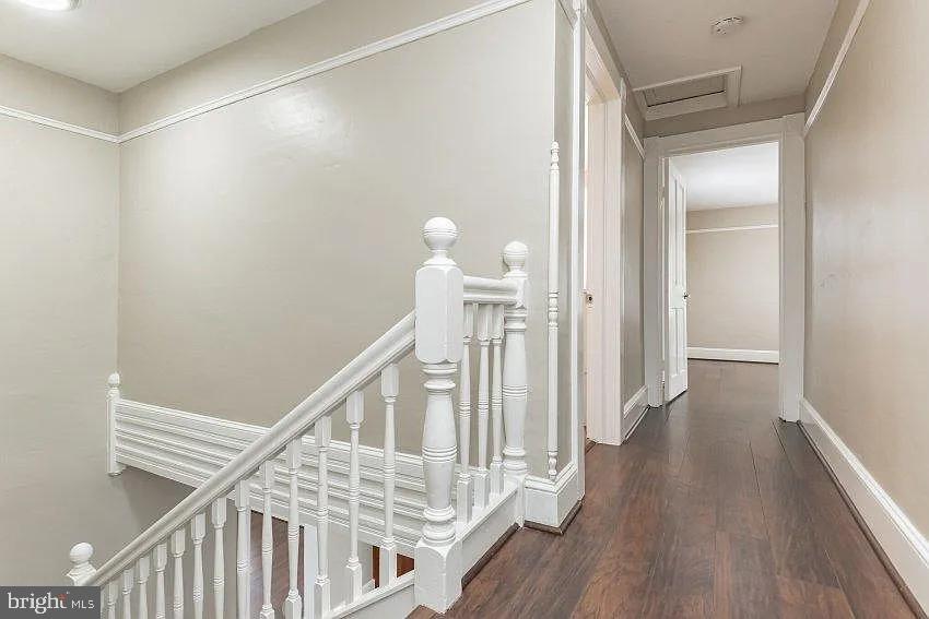 4090 Old Town Road Huntingtown, MD 20639 - Photo 9 of 20 a view of a hallway with wooden floor and staircase