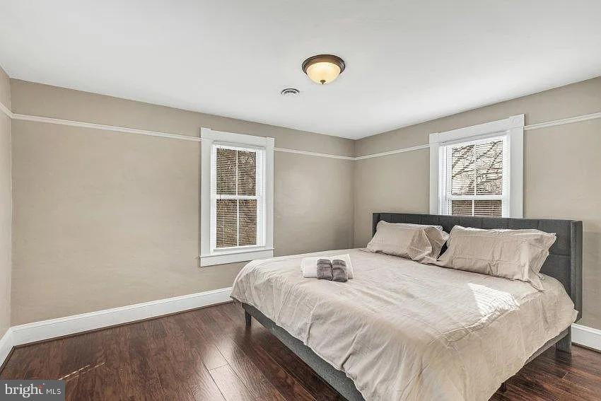 4090 Old Town Road Huntingtown, MD 20639 - Photo 10 of 20 a bedroom with a large bed and a window