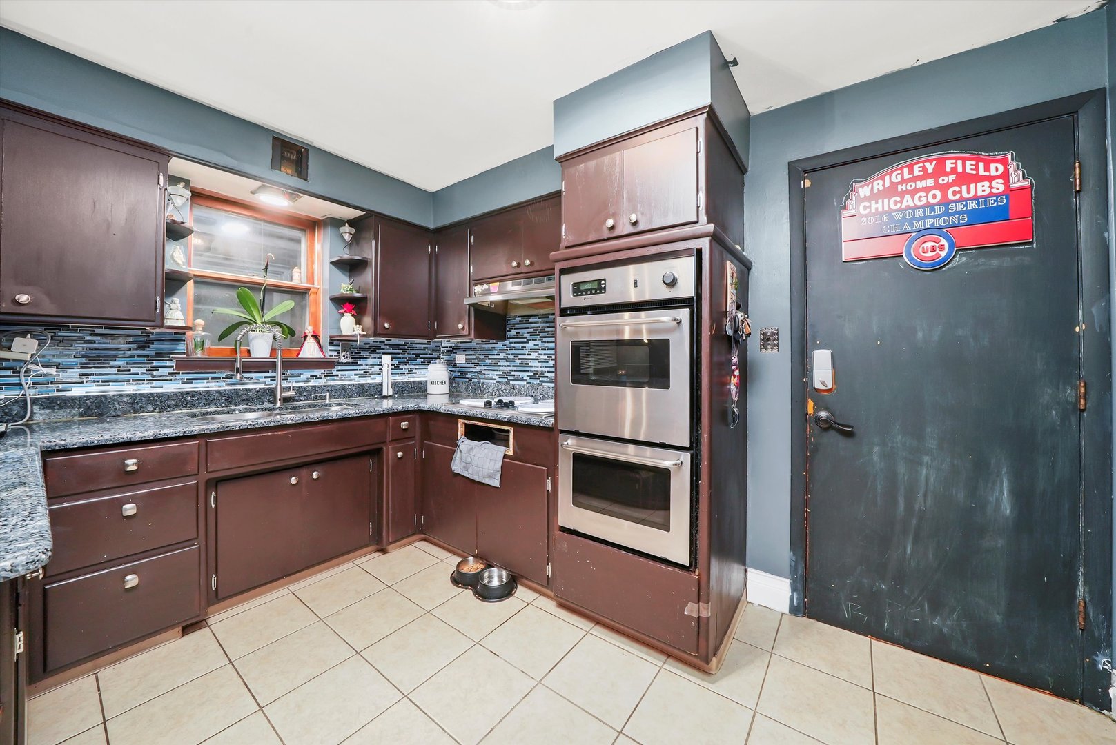 3543 West 57th Street Chicago, IL 60629 - Photo 11 of 43 a kitchen with stainless steel appliances granite countertop a refrigerator and a sink