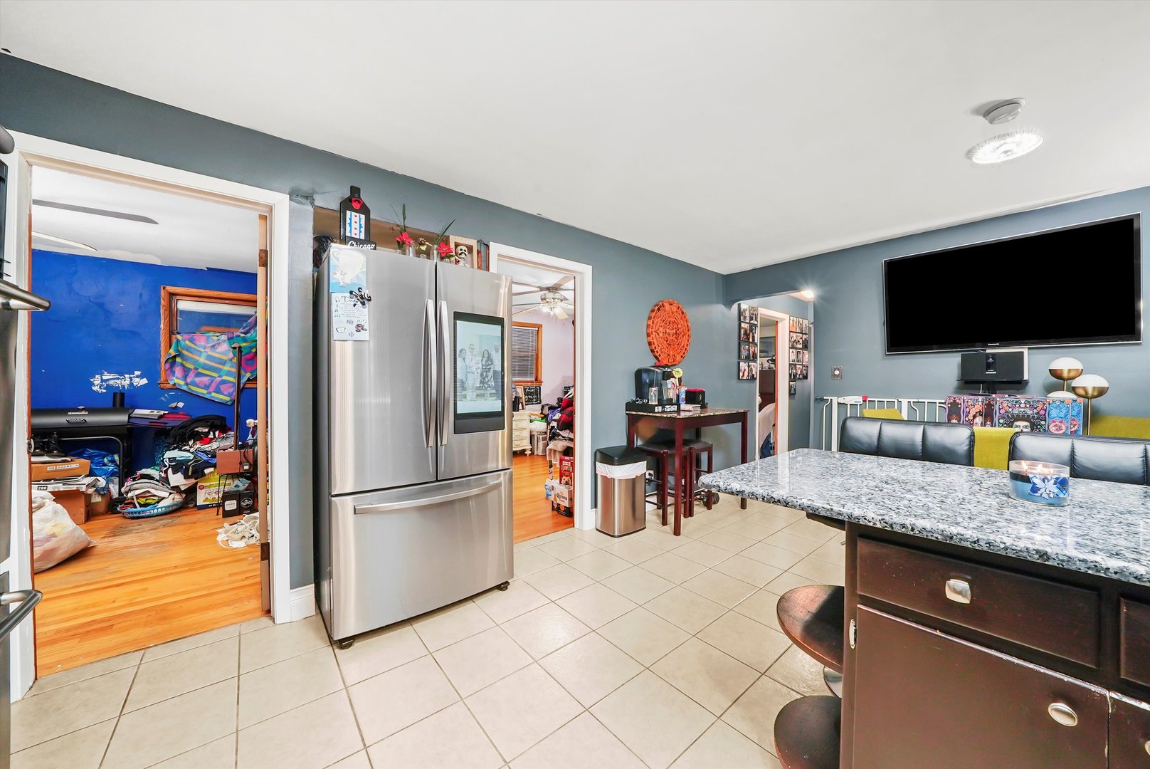3543 West 57th Street Chicago, IL 60629 - Photo 12 of 43 a kitchen with stainless steel appliances granite countertop a refrigerator and a sink
