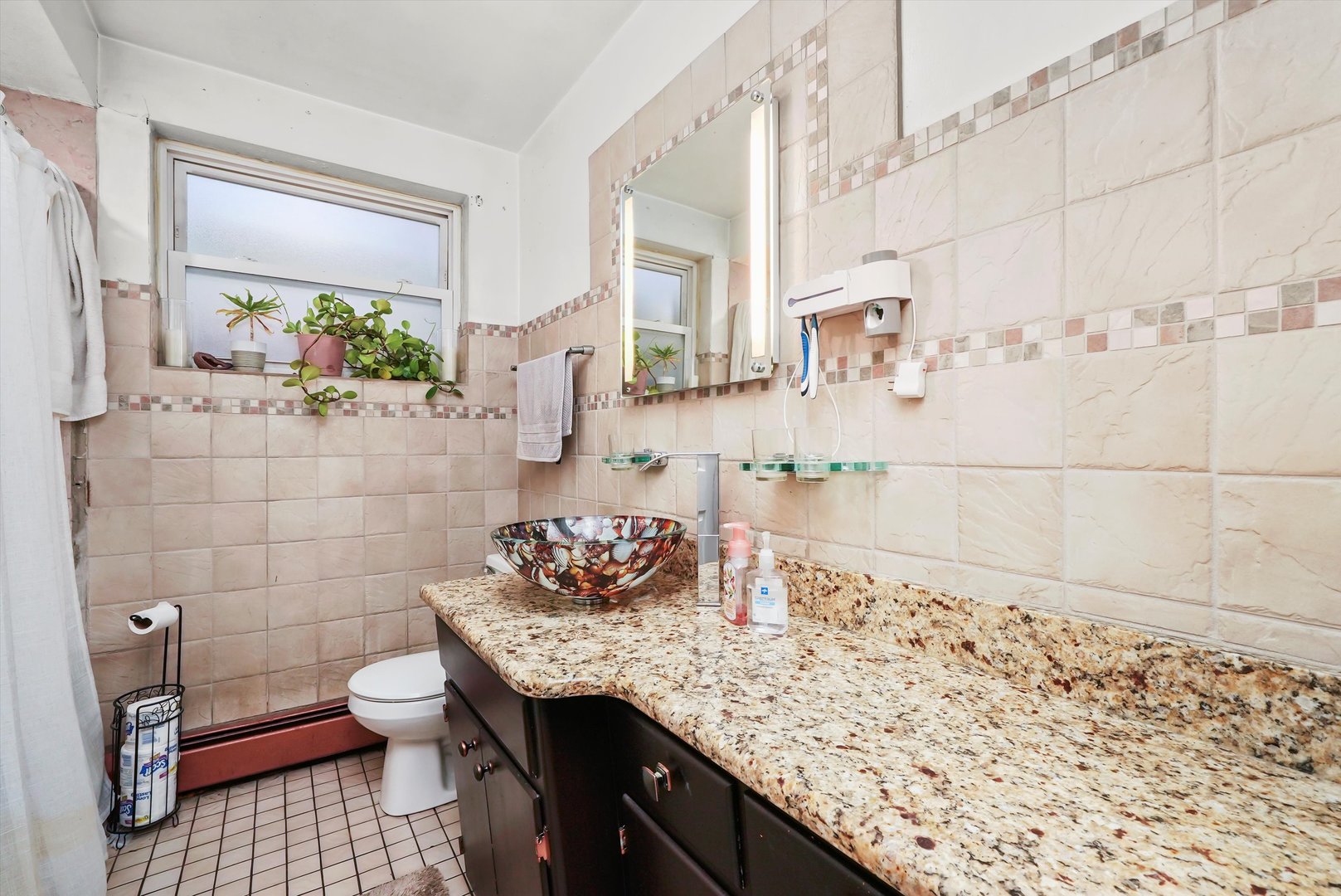 3543 West 57th Street Chicago, IL 60629 - Photo 15 of 43 a bathroom with a granite countertop sink a toilet and mirror