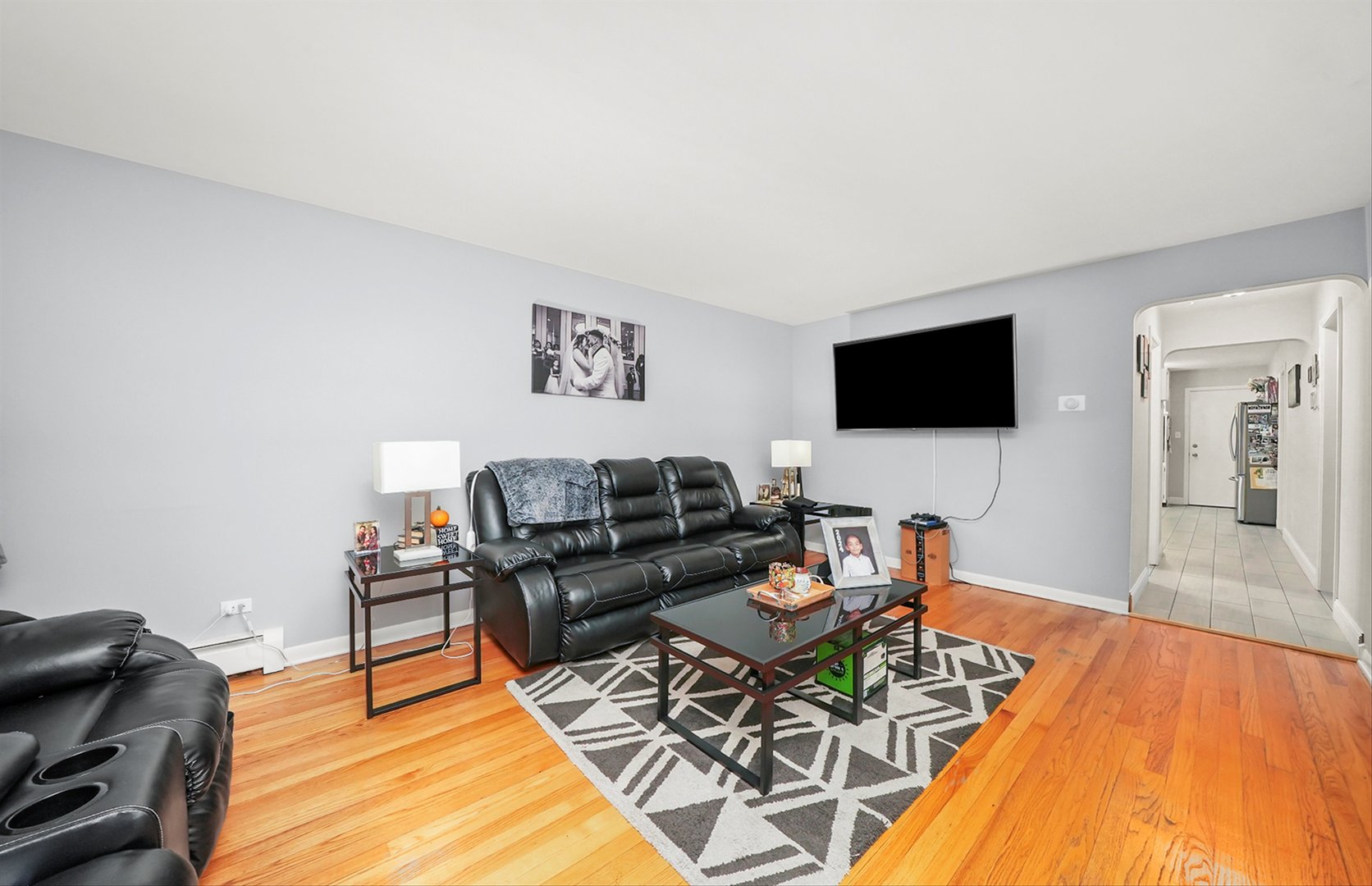 3543 West 57th Street Chicago, IL 60629 - Photo 16 of 43 a living room with furniture and a flat screen tv
