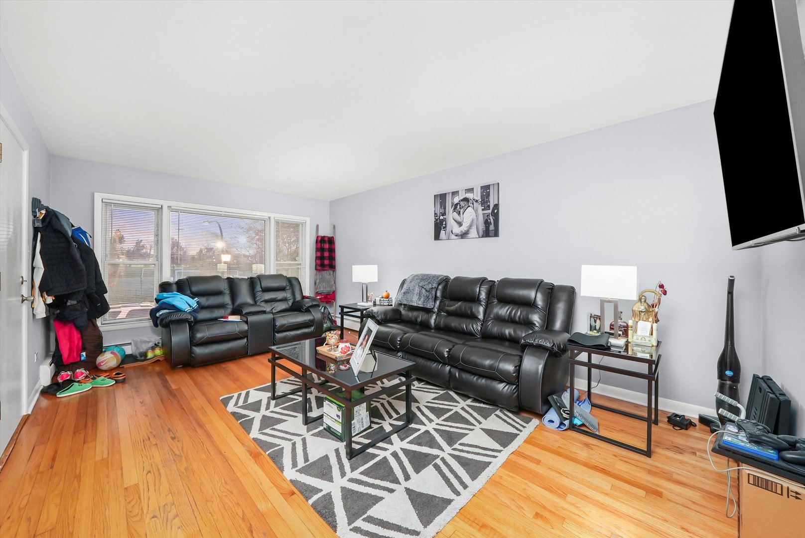 3543 West 57th Street Chicago, IL 60629 - Photo 17 of 43 a living room with furniture and a flat screen tv