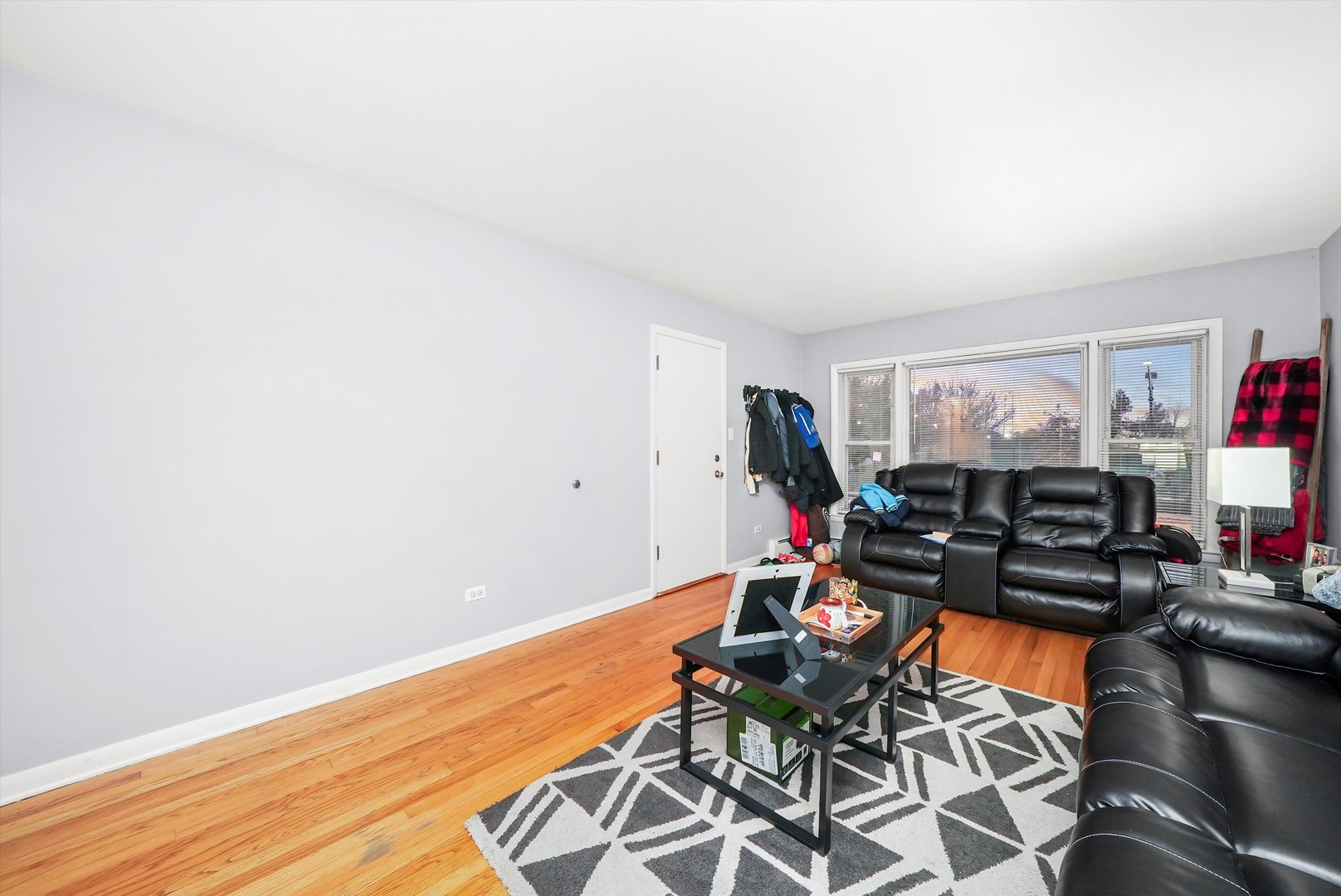 3543 West 57th Street Chicago, IL 60629 - Photo 18 of 43 a living room with furniture a air conditioner vent and a window