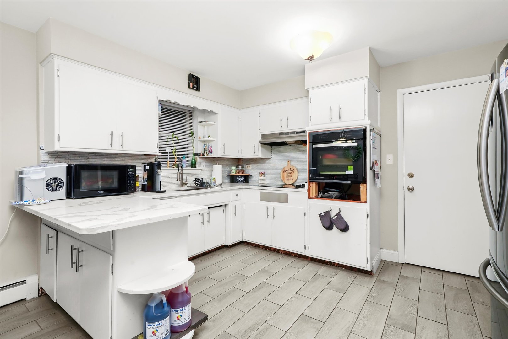 3543 West 57th Street Chicago, IL 60629 - Photo 20 of 43 a kitchen with white cabinets and white appliances