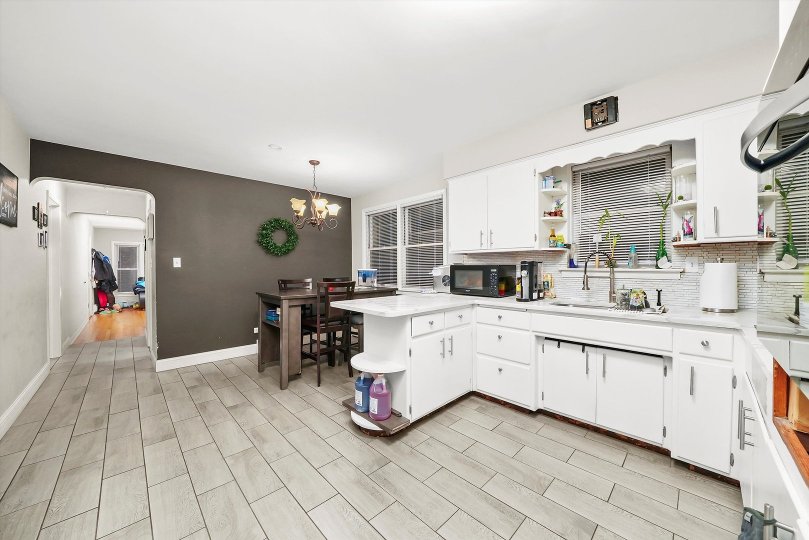3543 West 57th Street Chicago, IL 60629 - Photo 23 of 43 a large white kitchen with a large window