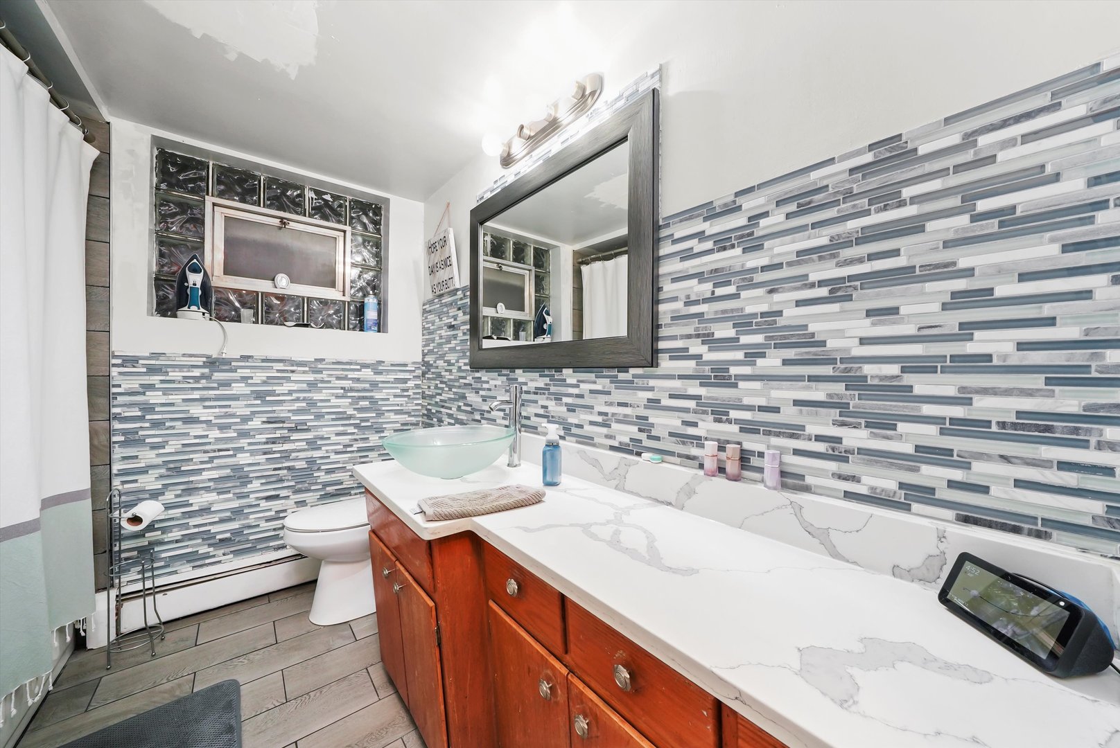 3543 West 57th Street Chicago, IL 60629 - Photo 28 of 43 a bathroom with a sink and a mirror