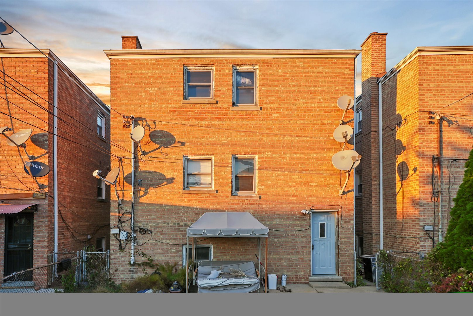 3543 West 57th Street Chicago, IL 60629 - Photo 38 of 43 a front view of a building with a street