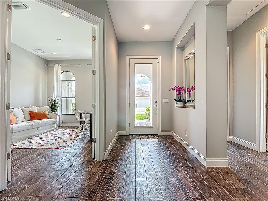 4524 Tamarind Way Naples, FL 34119 - Photo 2 of 50 Foyer with dark wood-type flooring, baseboards, and recessed lighting