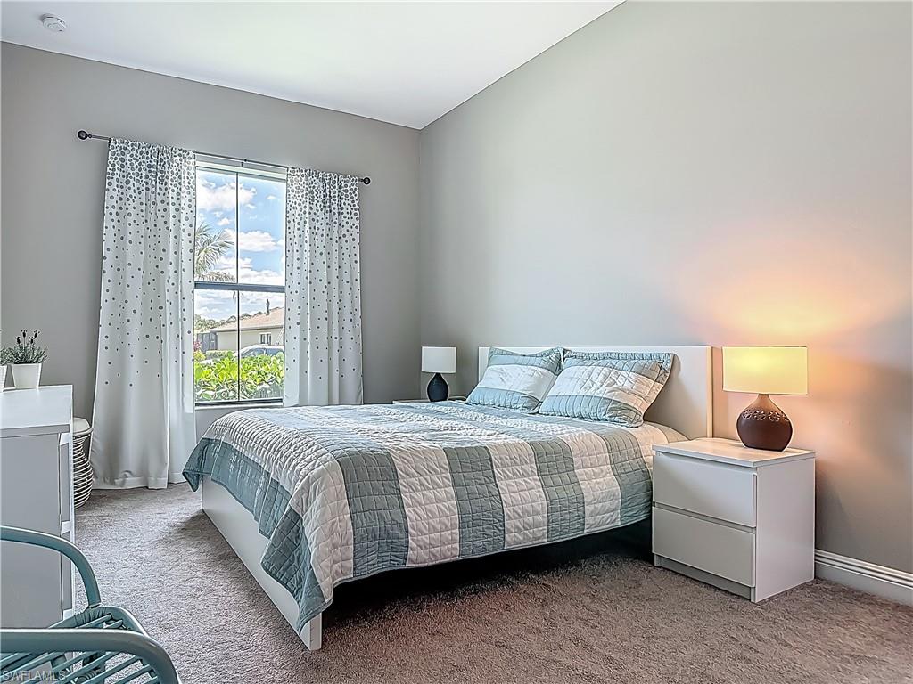 4524 Tamarind Way Naples, FL 34119 - Photo 22 of 50 Carpeted bedroom featuring baseboards