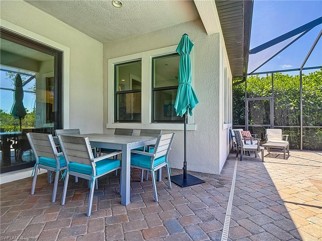 4524 Tamarind Way Naples, FL 34119 - Photo 39 of 50 View of patio / terrace with glass enclosure