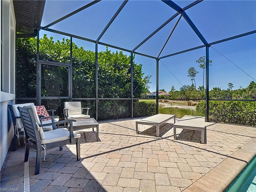 4524 Tamarind Way Naples, FL 34119 - Photo 43 of 50 View of patio / terrace with glass enclosure