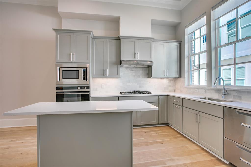 4639 New Water Lane Dallas, TX 75219 - Photo 1 of 20 a kitchen with stainless steel appliances granite countertop a sink and a stove