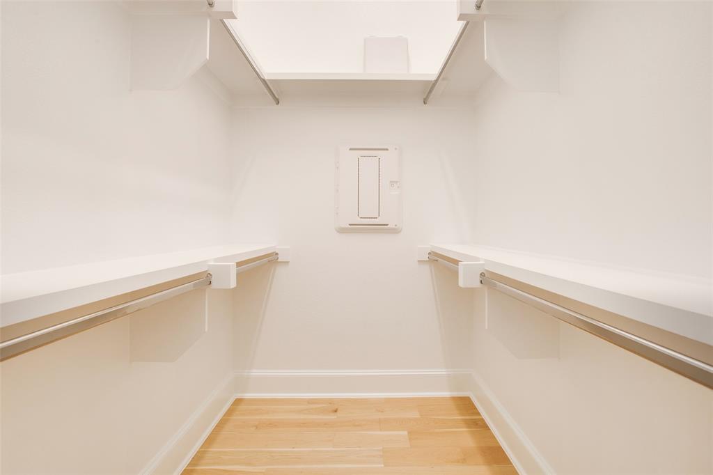 4639 New Water Lane Dallas, TX 75219 - Photo 12 of 20 a view of walk in closet with empty racks