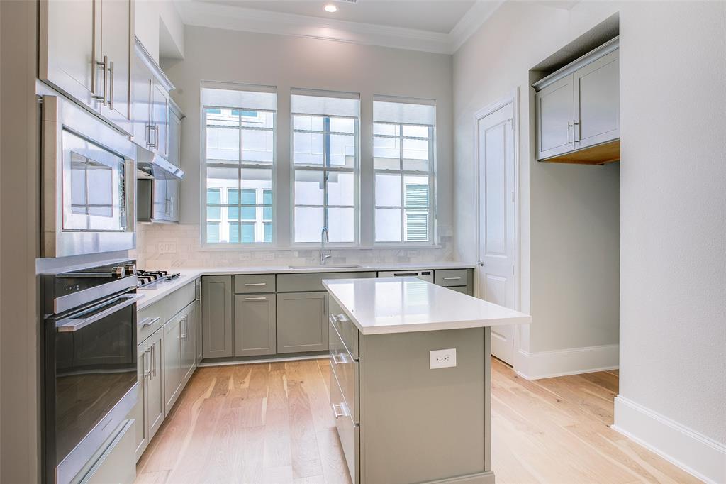4639 New Water Lane Dallas, TX 75219 - Photo 2 of 20 a kitchen with a sink stove and cabinets