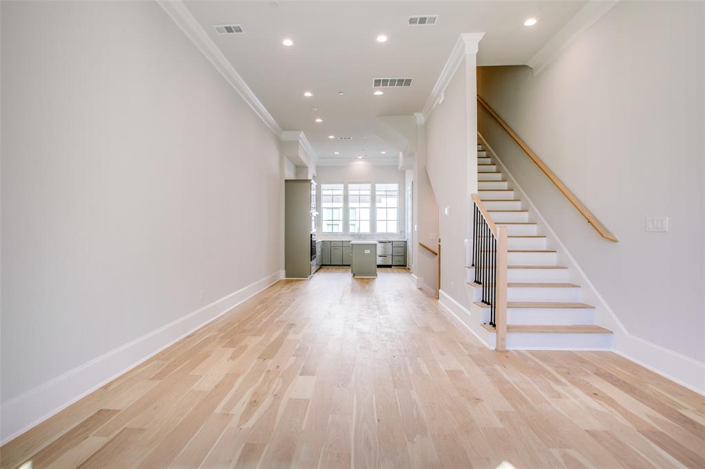4639 New Water Lane Dallas, TX 75219 - Photo 6 of 20 wooden floor in an empty room with a window