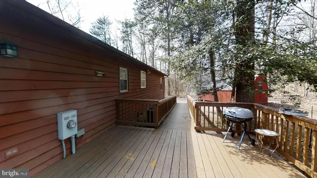 a view of a yard with wooden fence
