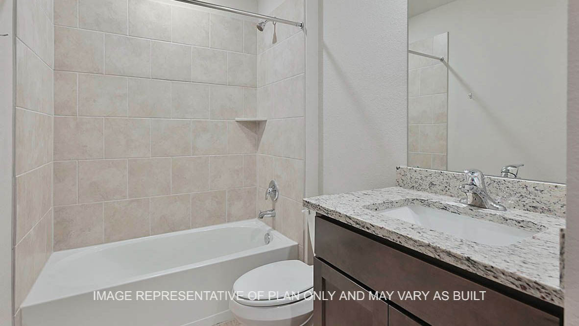 449 Combine Road Snook, TX 77879 - Photo 17 of 18 a bathroom with a granite countertop sink a toilet and bathtub