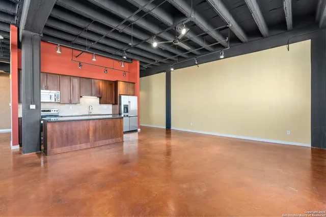a view of kitchen with furniture and a kitchen