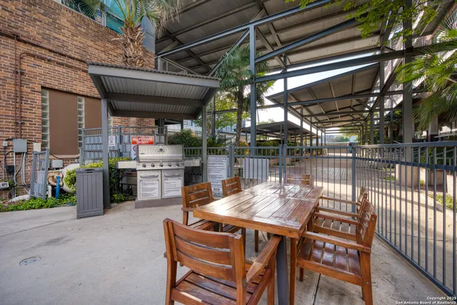 a view of a chairs and table in a patio