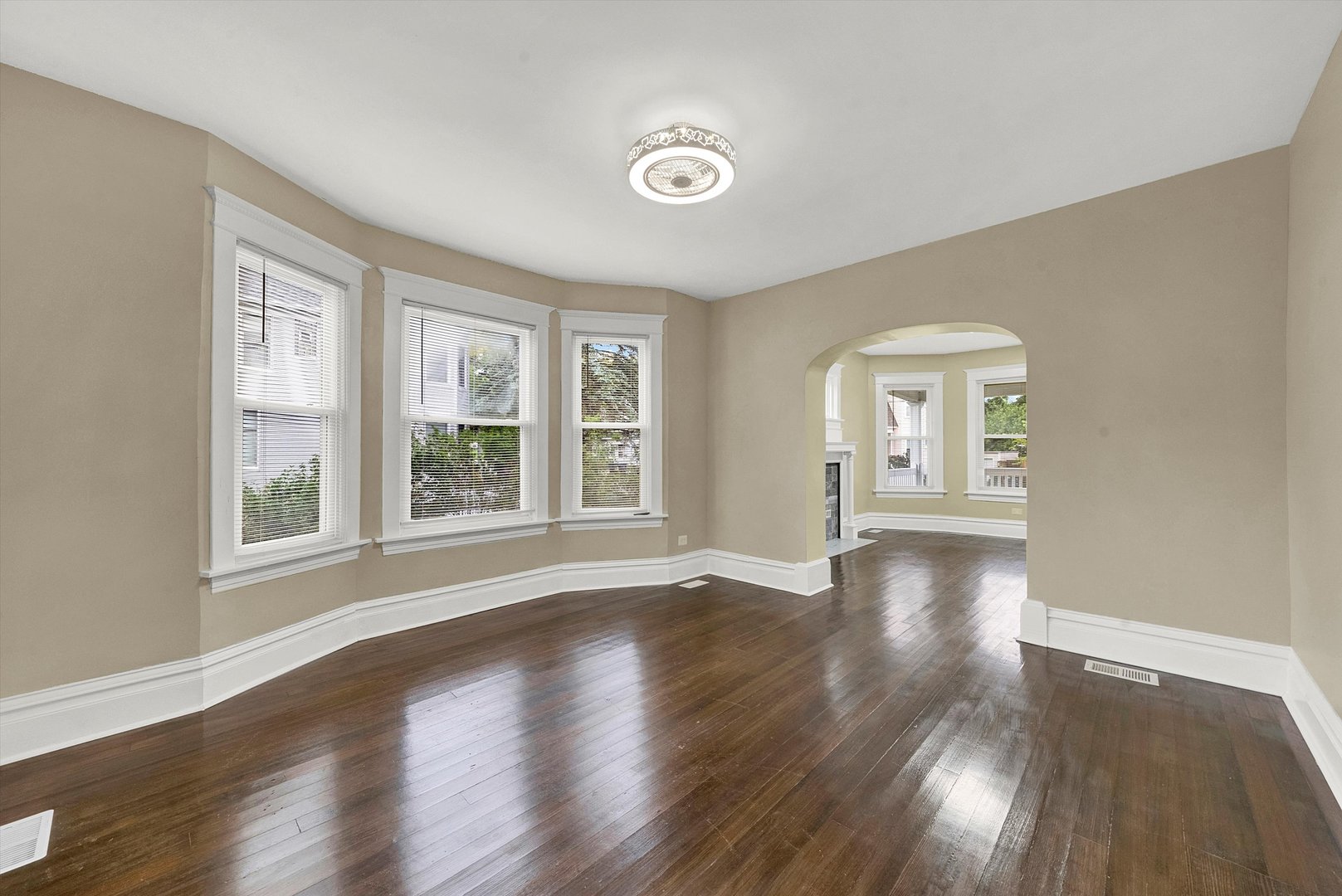 325 4th Street Waukegan, IL 60085 - Photo 11 of 34 a view of an empty room with wooden floor and a window