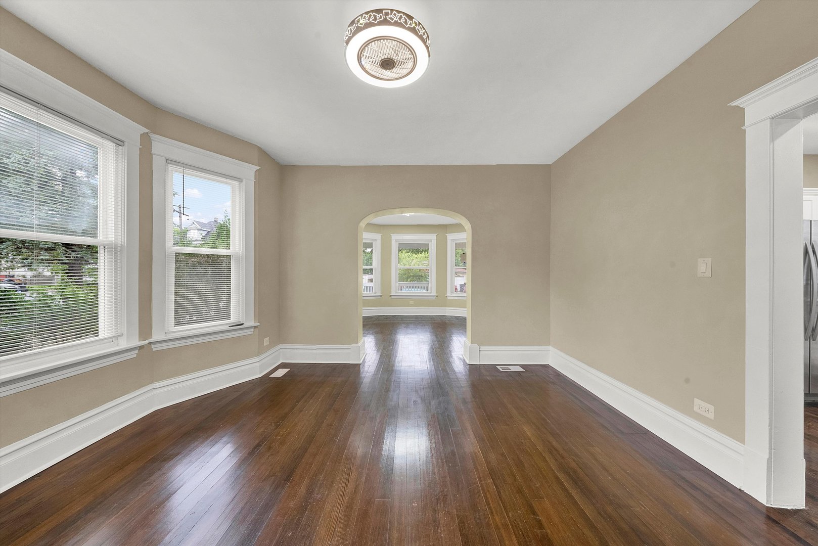 325 4th Street Waukegan, IL 60085 - Photo 12 of 34 a view of an empty room with wooden floor and a window
