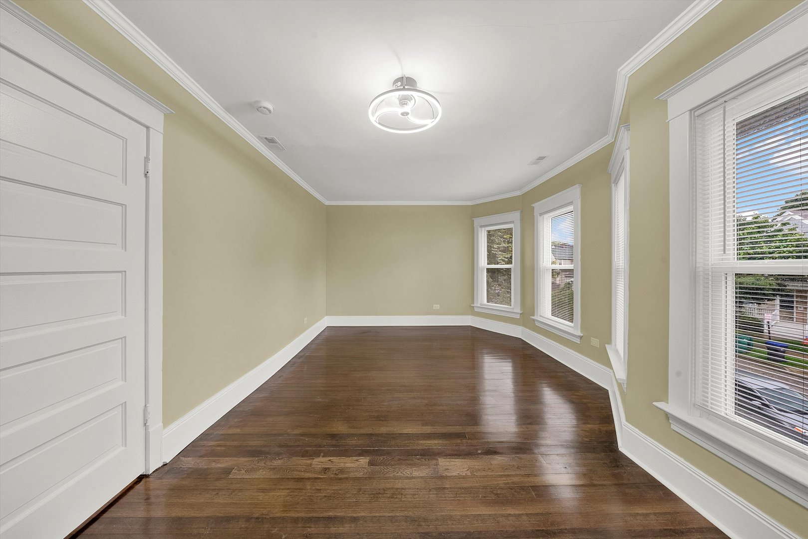 325 4th Street Waukegan, IL 60085 - Photo 19 of 34 a view of an empty room with wooden floor and a window