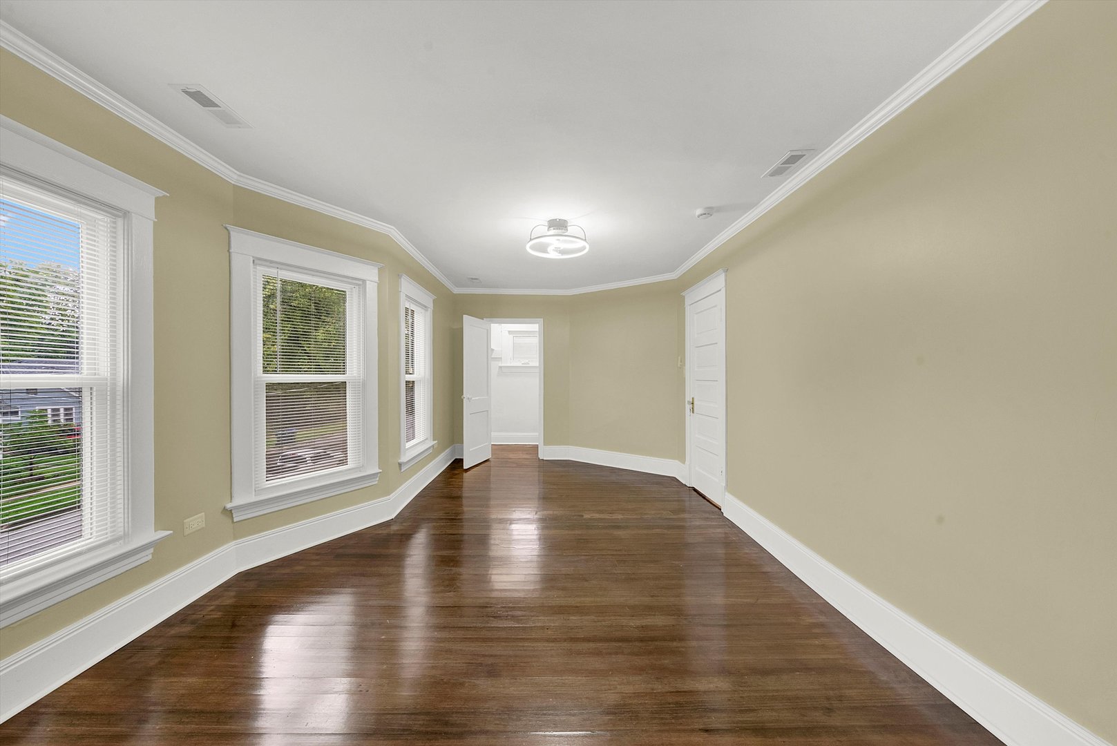 325 4th Street Waukegan, IL 60085 - Photo 20 of 34 a view of an empty room with wooden floor and a window