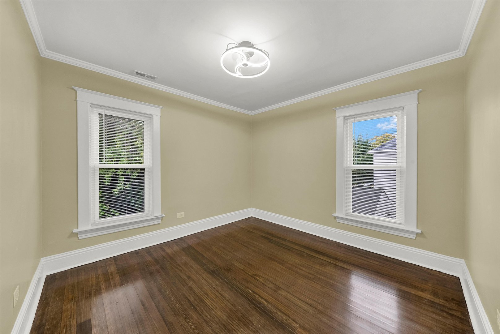 325 4th Street Waukegan, IL 60085 - Photo 24 of 34 a view of an empty room with wooden floor and a window