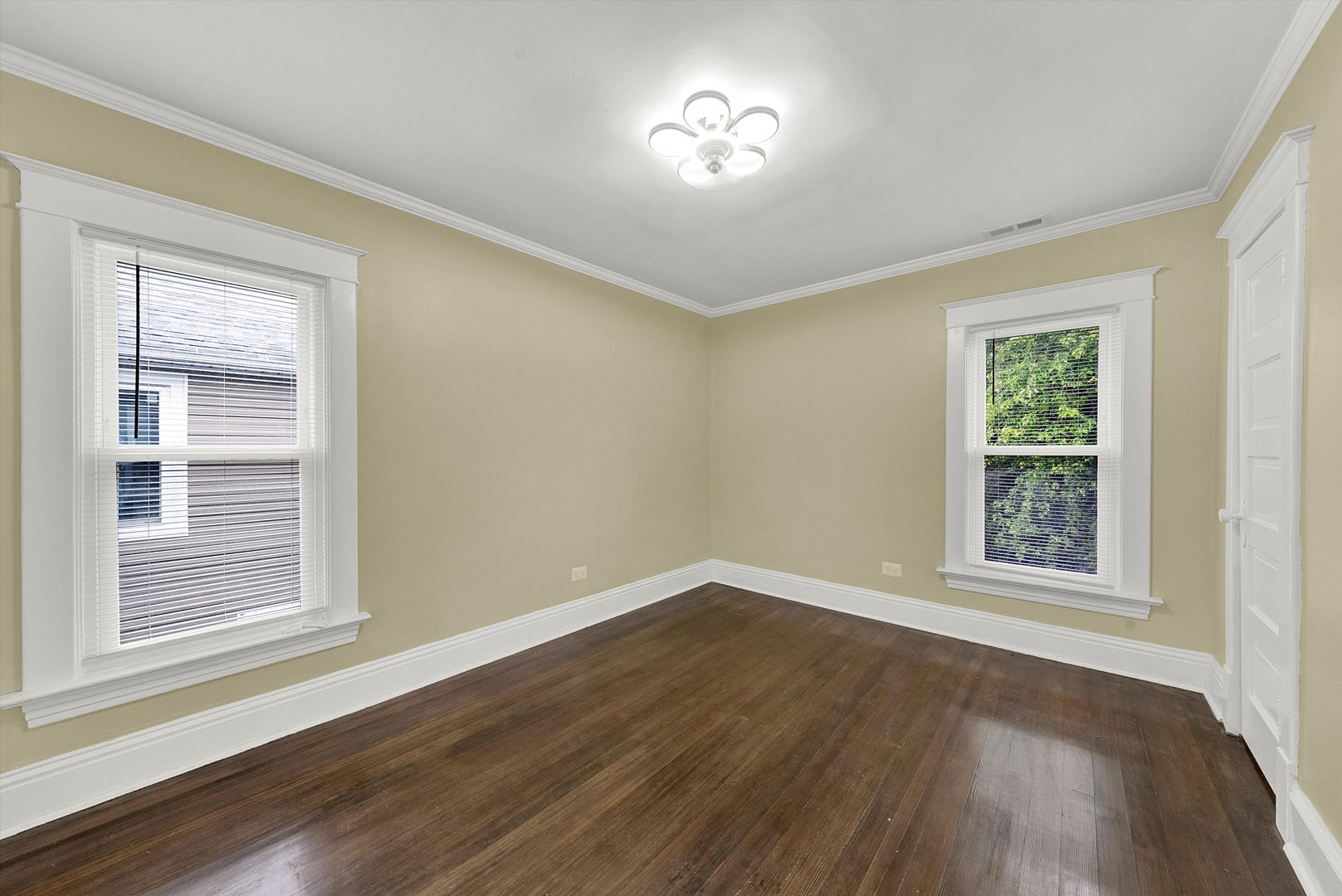 325 4th Street Waukegan, IL 60085 - Photo 25 of 34 a view of an empty room with a window and wooden floor