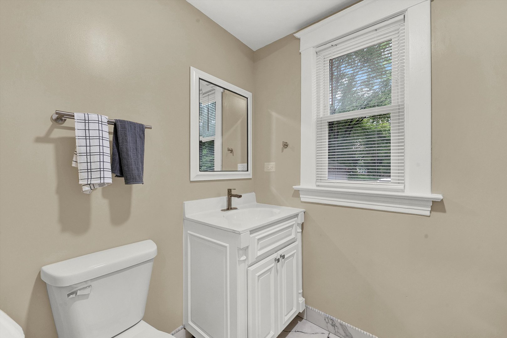 325 4th Street Waukegan, IL 60085 - Photo 26 of 34 a bathroom with a sink toilet and mirror