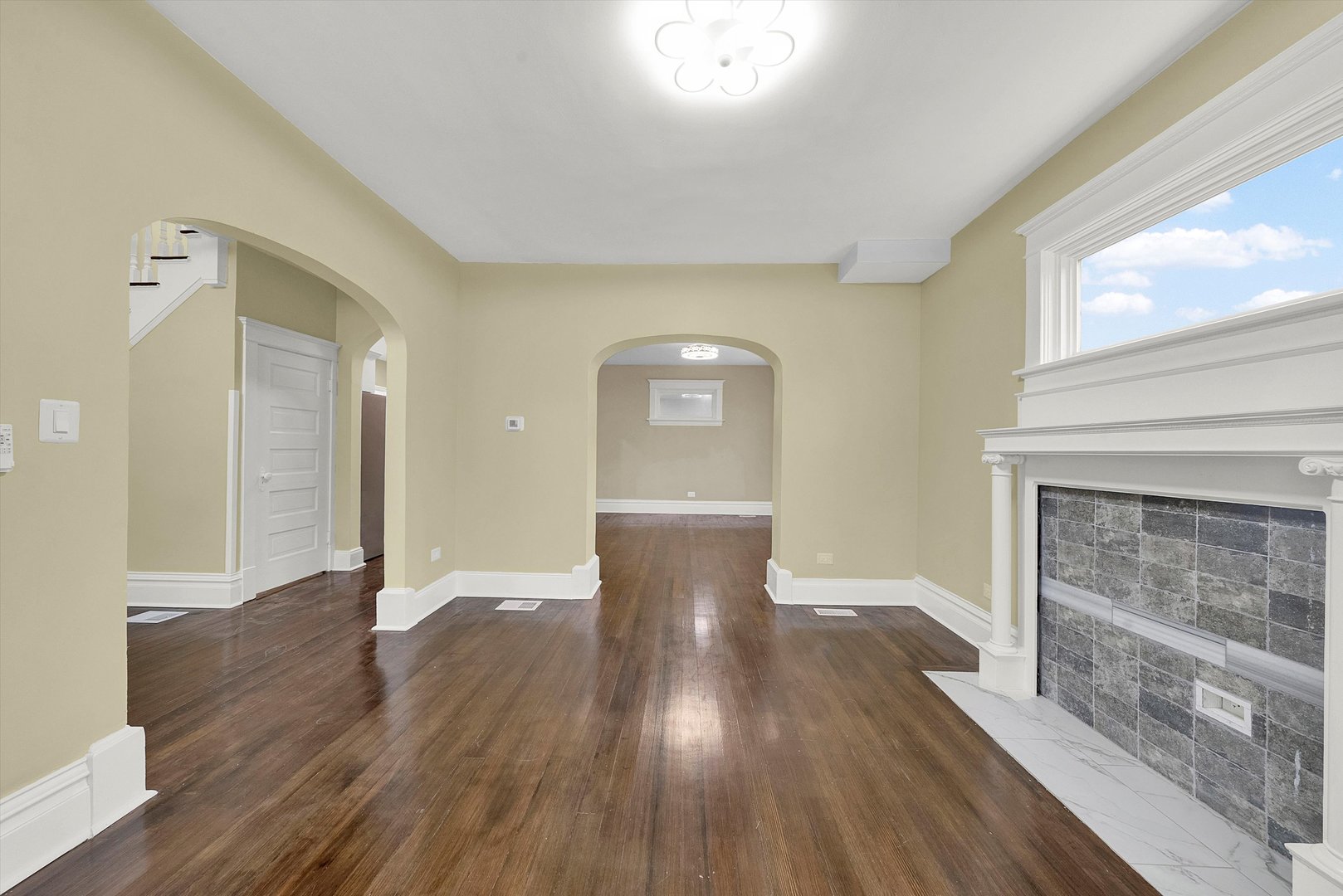 325 4th Street Waukegan, IL 60085 - Photo 4 of 34 a view of a kitchen with wooden floor and a fireplace