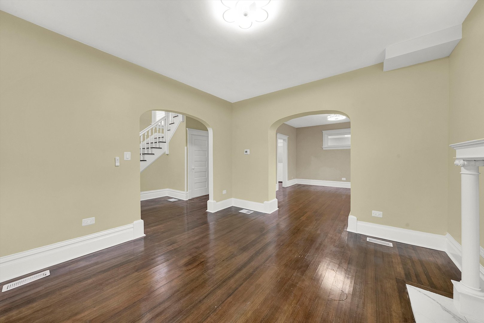 325 4th Street Waukegan, IL 60085 - Photo 5 of 34 an empty room with wooden floor and windows