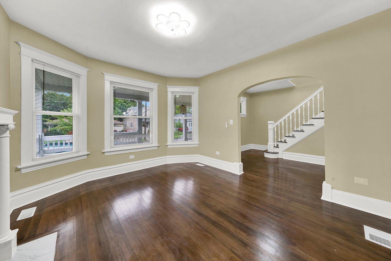325 4th Street Waukegan, IL 60085 - Photo 6 of 34 a view of an empty room with wooden floor and a window