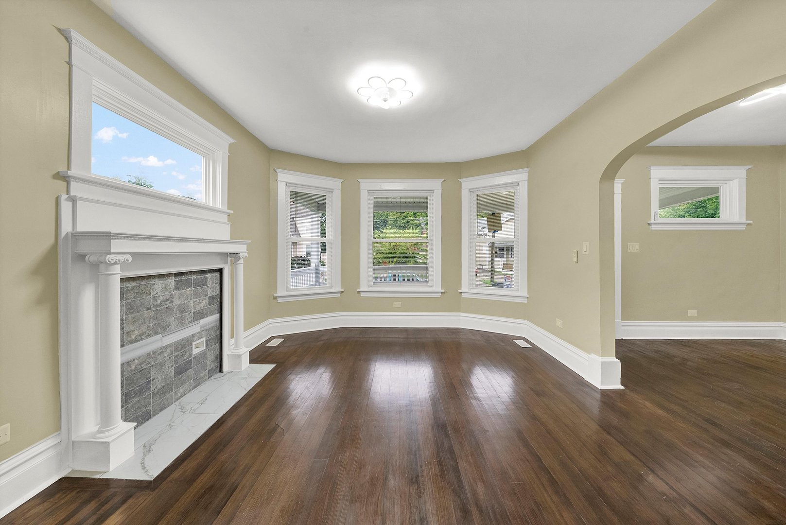325 4th Street Waukegan, IL 60085 - Photo 7 of 34 a view of an empty room with wooden floor and a window