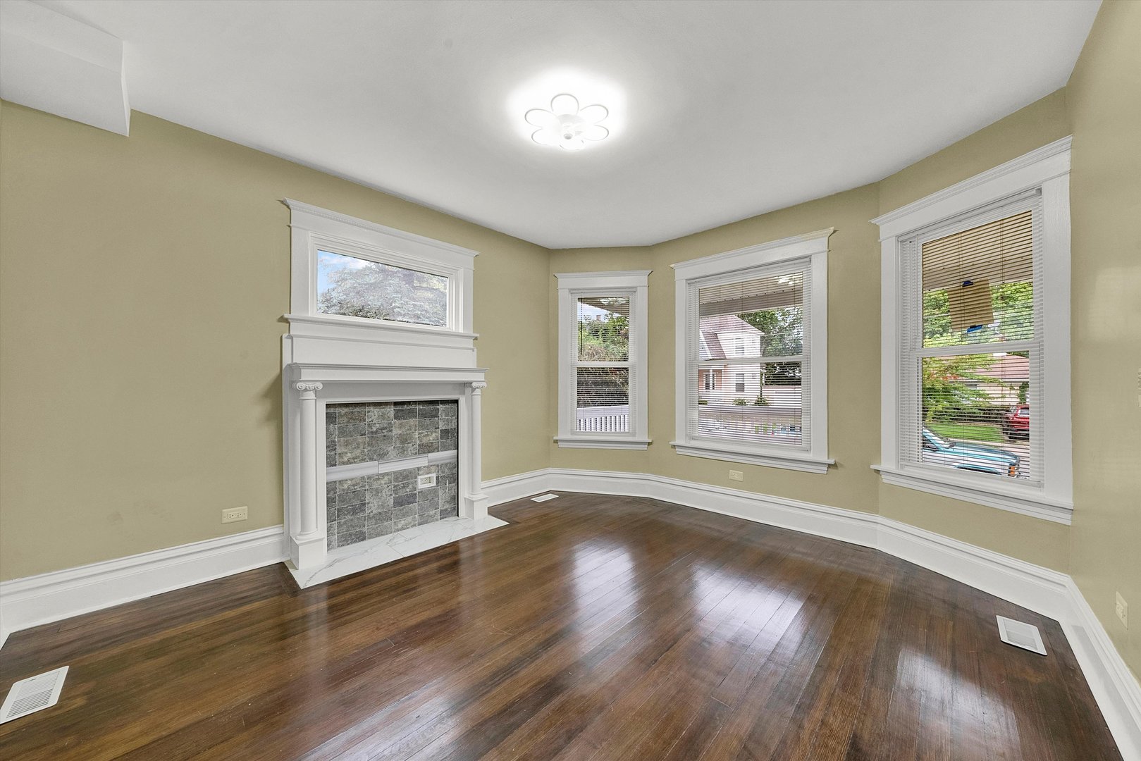 325 4th Street Waukegan, IL 60085 - Photo 8 of 34 a view of an empty room with wooden floor and a window