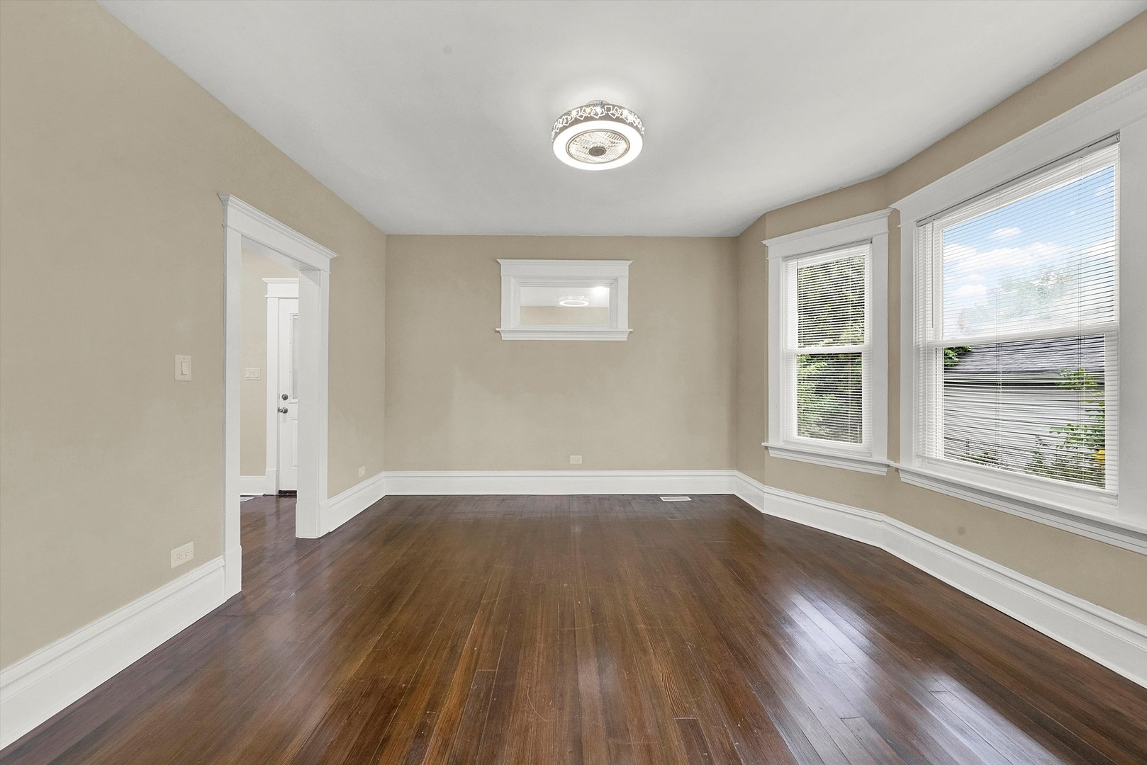 325 4th Street Waukegan, IL 60085 - Photo 10 of 34 a view of an empty room with wooden floor and a window