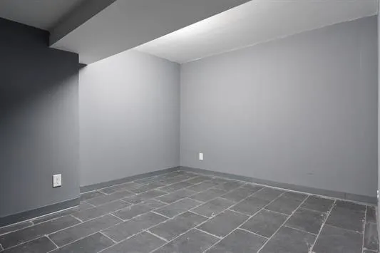 an empty room with a bathroom