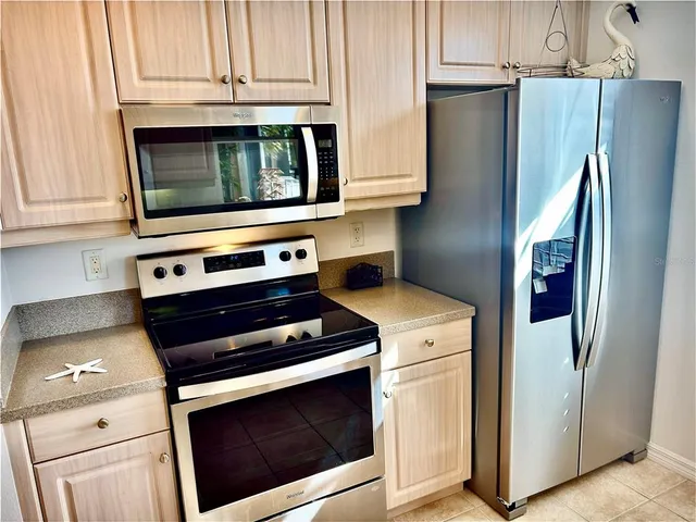 a kitchen with a sink and a large window