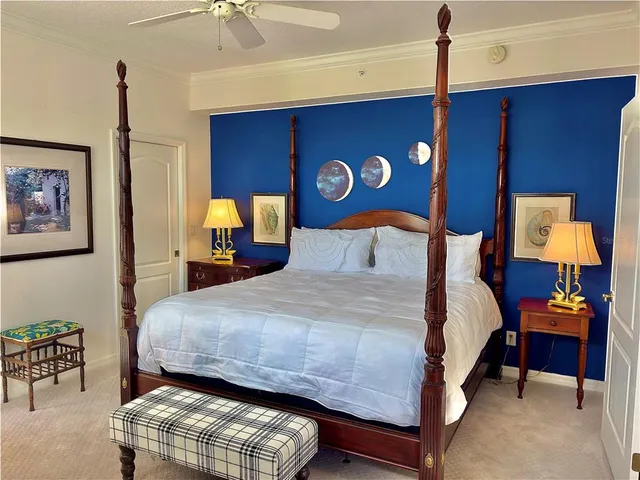 a bedroom with a bed and a lamp