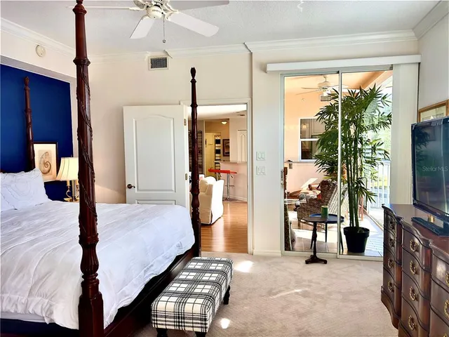 a bedroom with a bed and a lamp