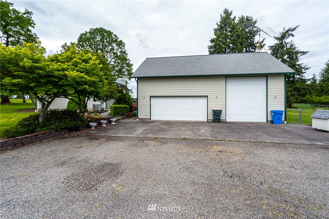 249 South Military Road Winlock, WA 98596 - Photo 2 of 33 a front view of a house with a yard and garage