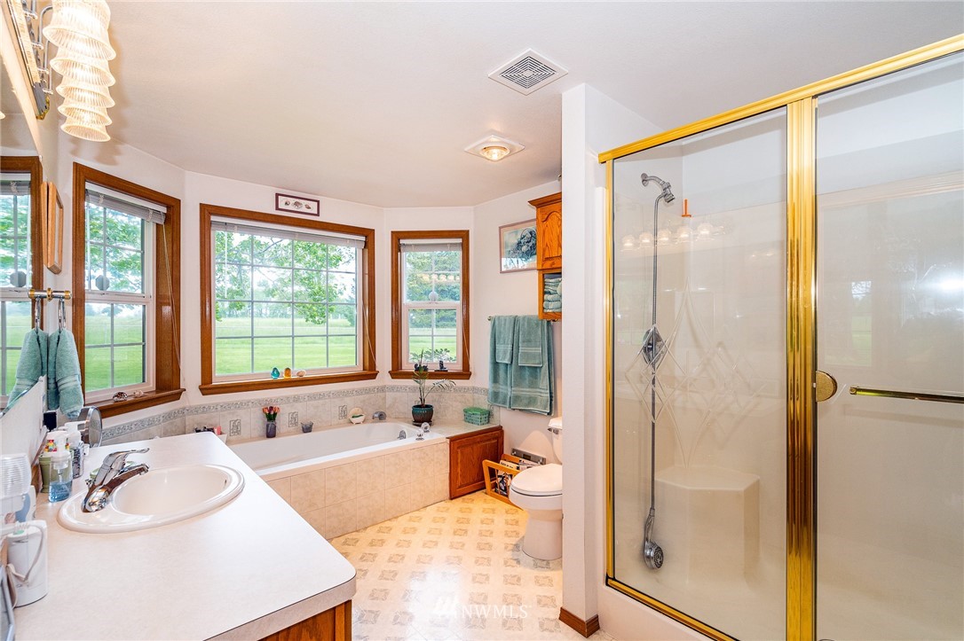249 South Military Road Winlock, WA 98596 - Photo 22 of 33 a spacious bathroom with a tub shower and sink