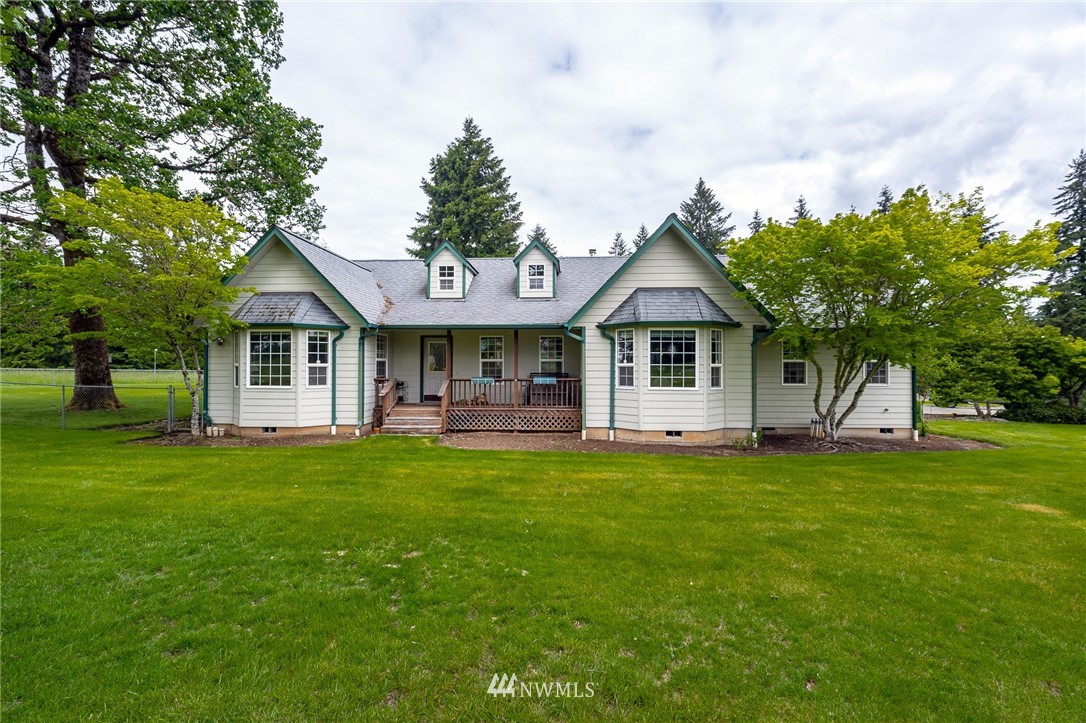 249 South Military Road Winlock, WA 98596 - Photo 27 of 33 a front view of a house with a garden and trees