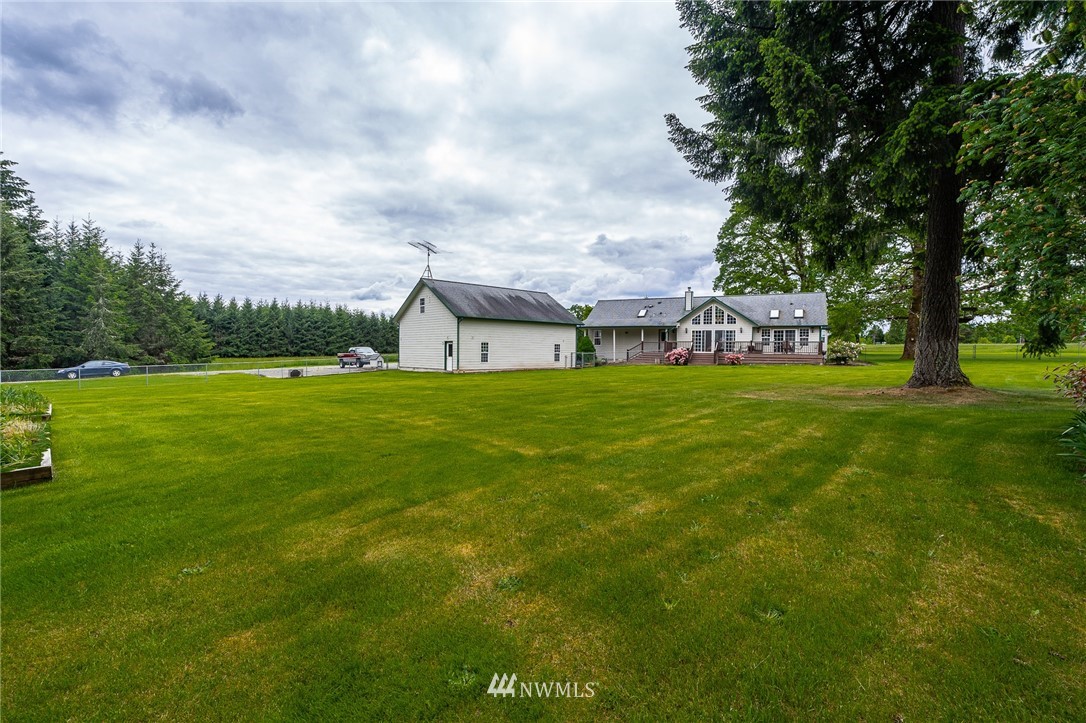 249 South Military Road Winlock, WA 98596 - Photo 30 of 33 a view of a house with a big yard and large trees