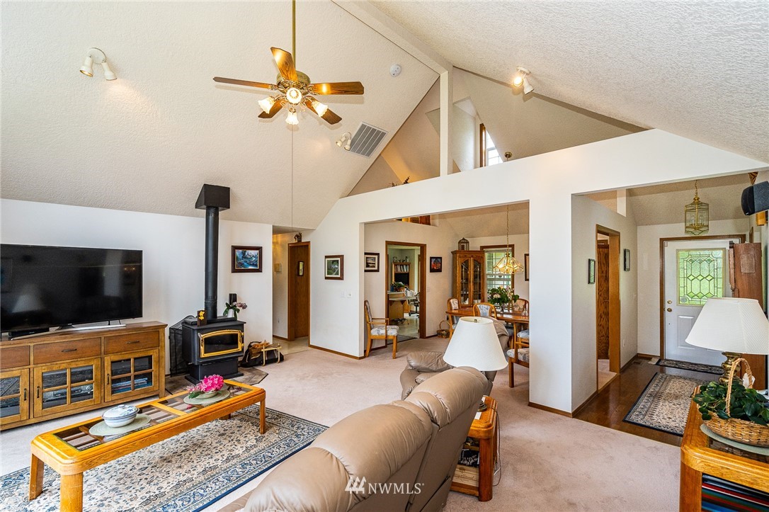 249 South Military Road Winlock, WA 98596 - Photo 4 of 33 a living room with furniture and a flat screen tv