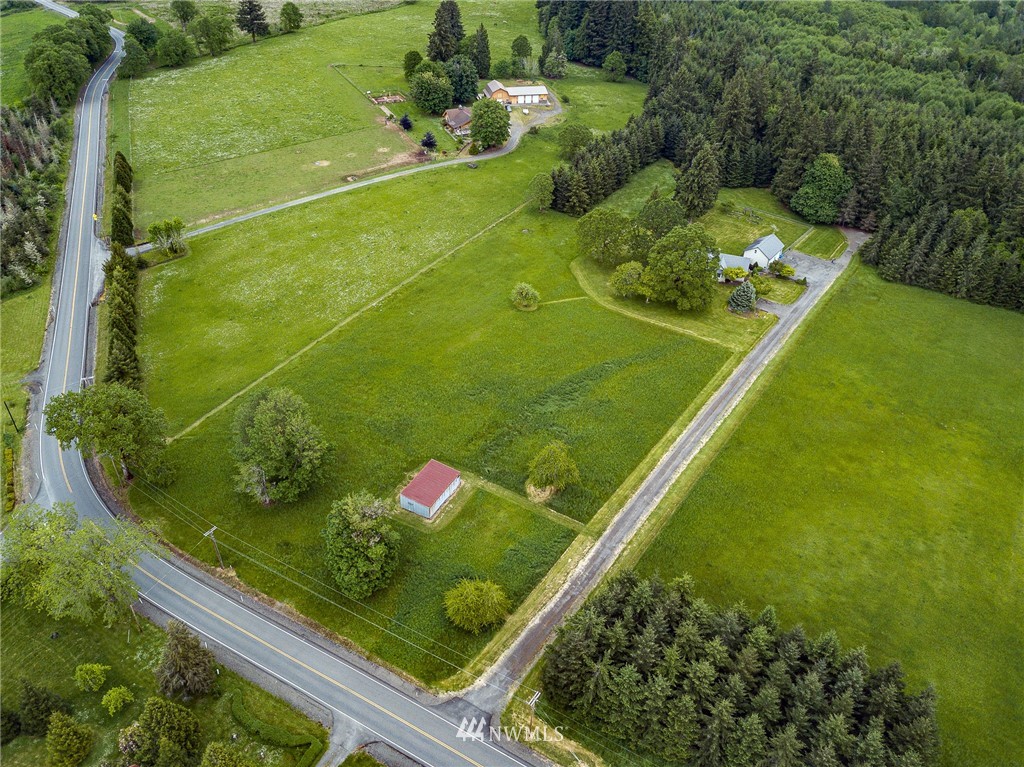 249 South Military Road Winlock, WA 98596 - Photo 33 of 33 a view of a back yard of the house and green space