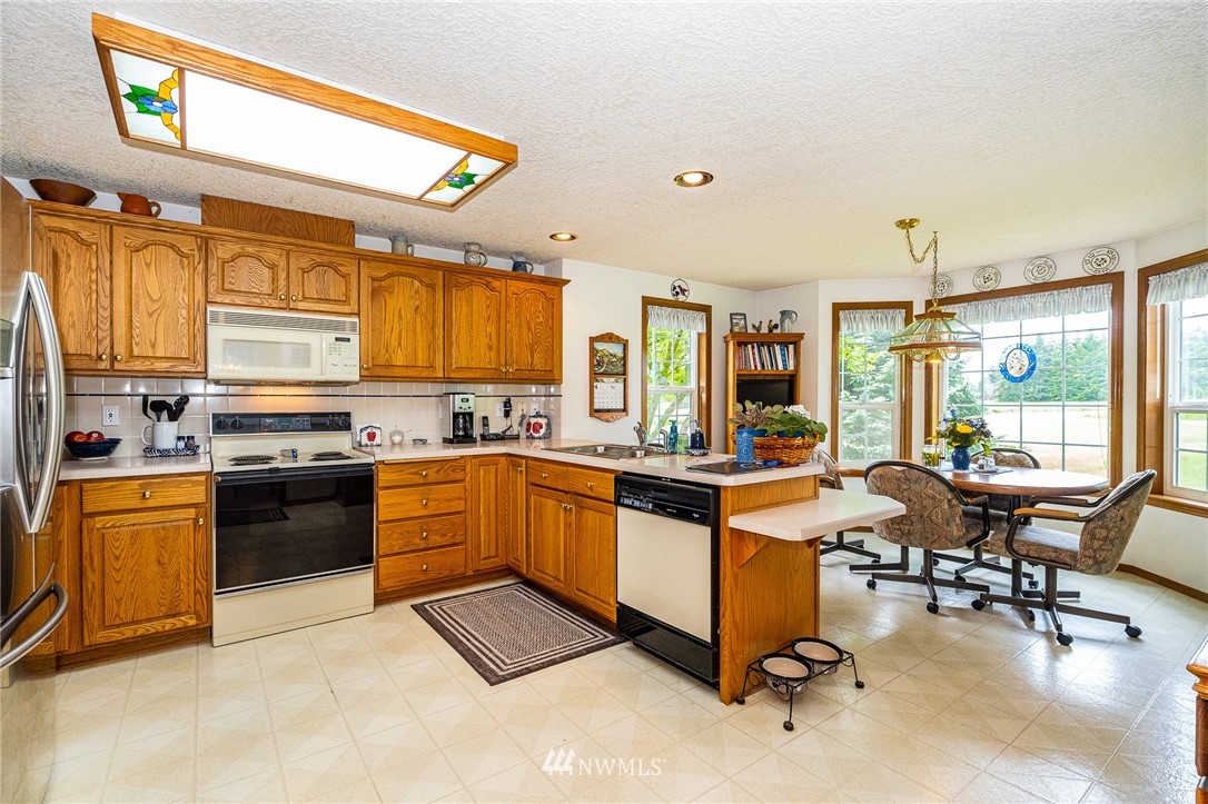 249 South Military Road Winlock, WA 98596 - Photo 9 of 33 a kitchen with stainless steel appliances granite countertop a stove and cabinets