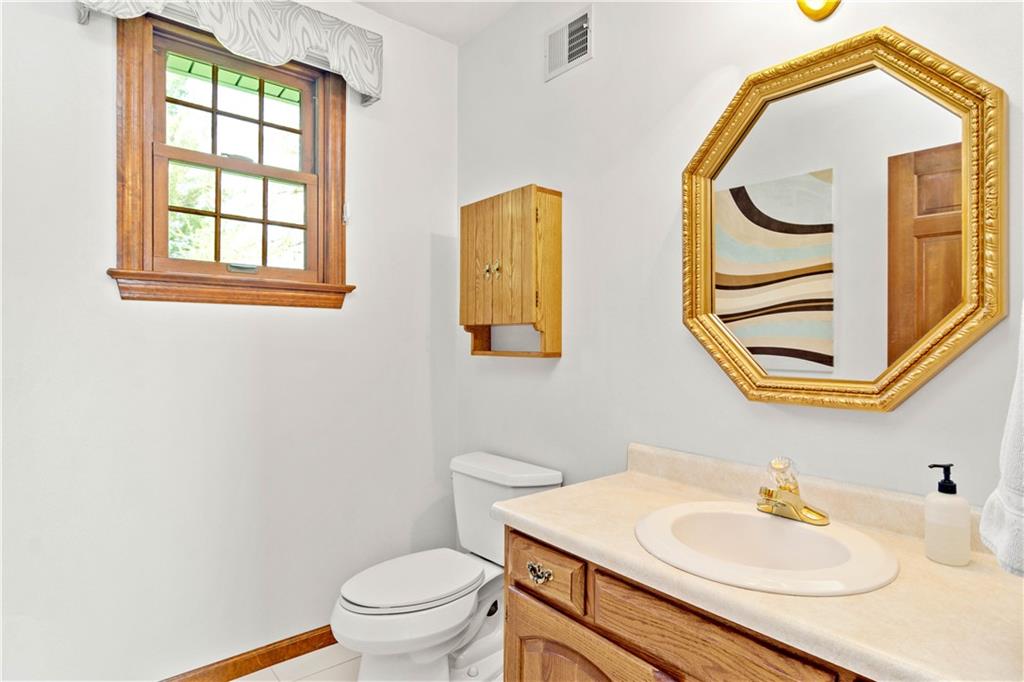 313 Knobs Hill Court Wexford, PA 15090 - Photo 12 of 25 a bathroom with a sink and a mirror