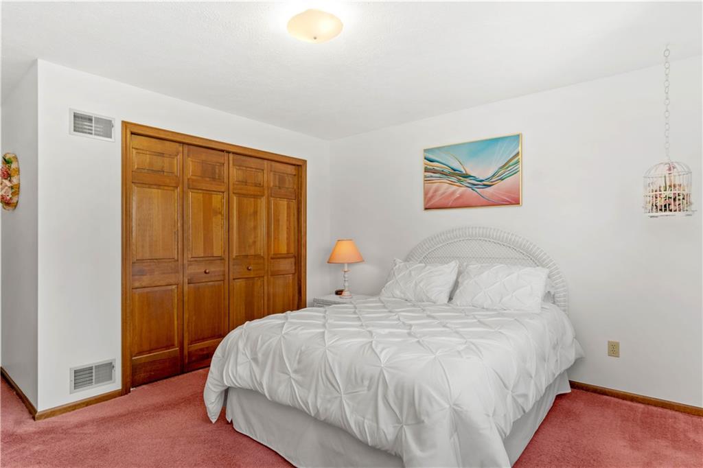 313 Knobs Hill Court Wexford, PA 15090 - Photo 15 of 25 a bedroom with a bed and a painting on the wall